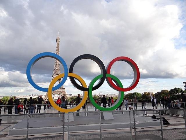 <p><em>Image: Jea. via <a href="https://commons.wikimedia.org/wiki/File:Olympic_rings_in_the_Place_du_Trocad%C3%A9ro_in_Paris.jpg">Wikimedia Commons</a>, <a href="https://creativecommons.org/licenses/by-sa/4.0/deed.en">CC BY-SA 4.0</a>.</em></p>