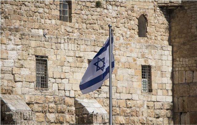 Israel flag against wall.