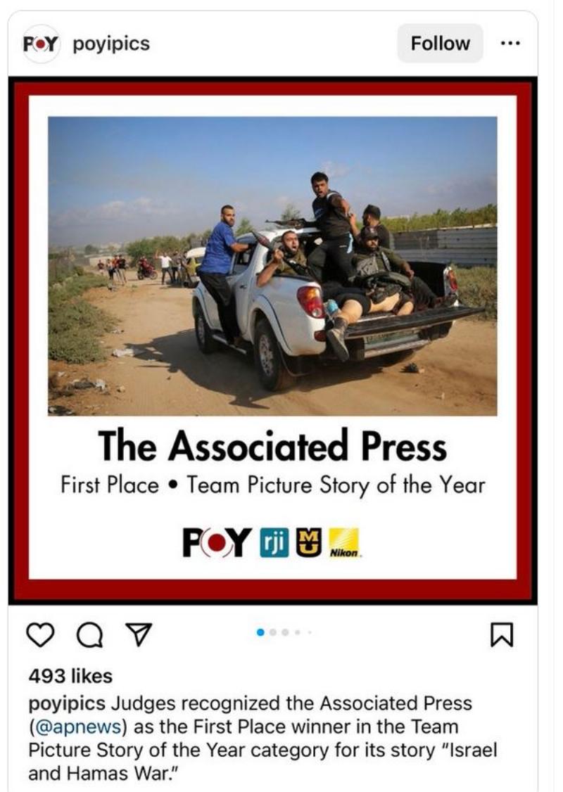 NextImg:Vile: AP wins award for photo of Hamas terrorists proudly posing with their 'kill' like big game hunters