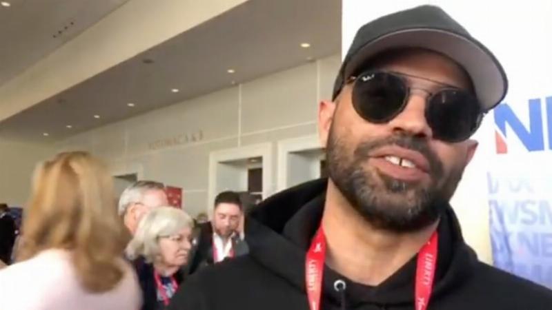 NextImg:CPAC 2025: Proud Boys’ Enrique Tarrio and Richard “feet on the desk” Barnett