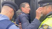 Irish teacher Enoch Burke is hauled away in a paddywagon because he won’t participate in the abuse of a young boy