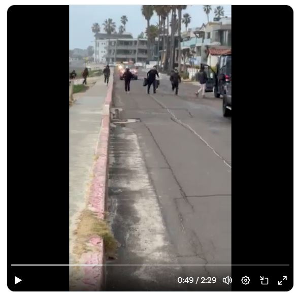 Border surge spreads west, video shows migrants rolling into La Jolla's Windansea Beach