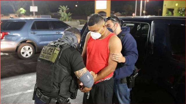 Deportation. An illegal is deported by ICE