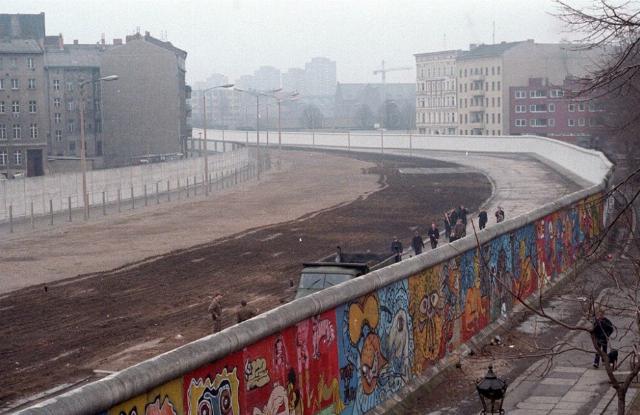 <p><em>Image: Thierry Noir via <a href="https://en.wikipedia.org/wiki/Berlin_Wall#/media/File:Berlinermauer.jpg">Wikimedia Commons</a>, <a href="https://creativecommons.org/licenses/by-sa/3.0/deed.en">CC BY-SA 3.0</a>.</em></p>