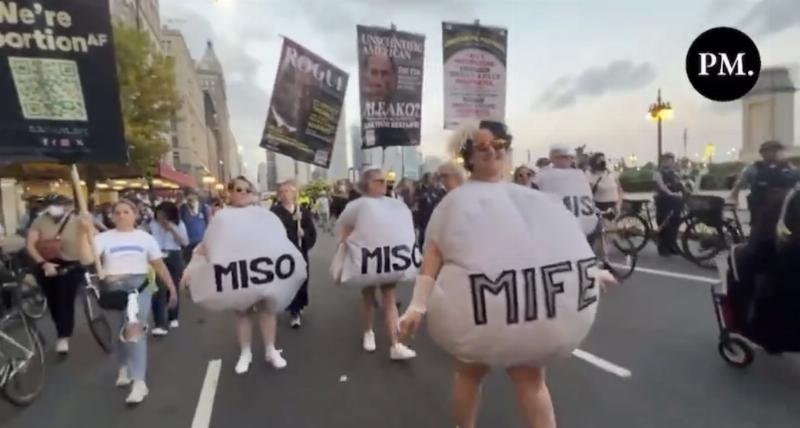 NextImg:Women dressed as abortion pills protest outside DNC